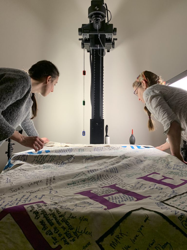 Picture of DSL lab staff imaging the AIDS quilt with the Phase One Camera