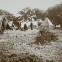 People standing outside of tents, 1891