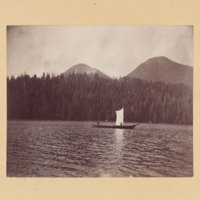 2 men in boat, possibly in Yellowstone Lake in Yellowstone National Park<br />
