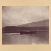 2 men in boat, possibly in Yellowstone Lake in Yellowstone National Park<br />
