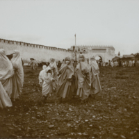 Group of women standing outside Tetouan city wall, 1891