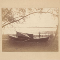 Boat on bank, possibly by Yellowstone Lake in Yellowstone National Park<br />
